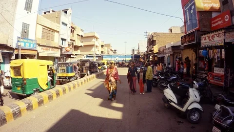 Train crosses street auto rickshaws wait for free road central part of Bikaner Stock Footage 90796156