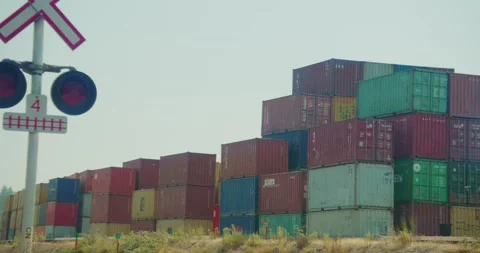 Train Crossing and Shipping Containers Stock Footage 158778935