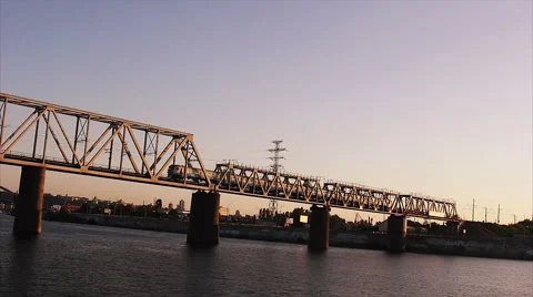 Train crossing bridge above the river. Stock Footage 67569154
