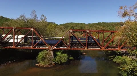 Train crossing bridge aerial Stock Footage 69072853