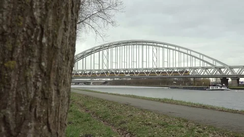 Train crossing bridge, Freighter passing by. Video stock 75410918