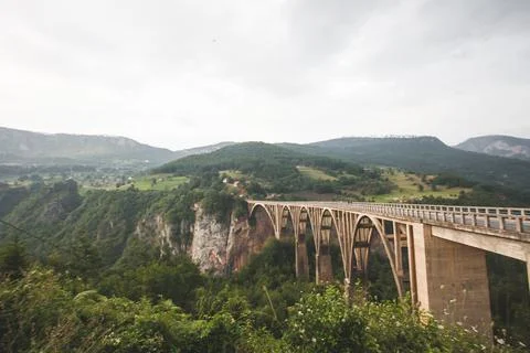 A train crossing a bridge over a river Stock Photos