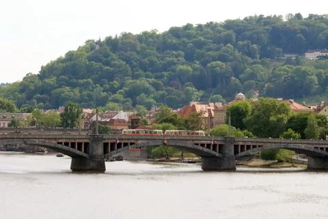 Train crossing bridge over river Stock Photos