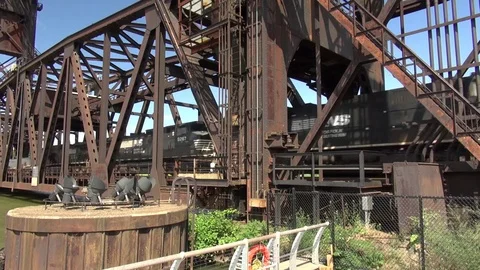 Train crossing drawbridge over river, downtown Cleveland, Ohio Stock Footage 81922498