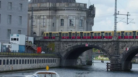 Train Crossing Historic Bridge Over River in Berlin Cityscape Stock Footage 322091318