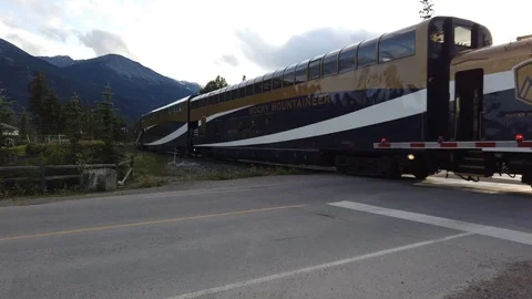 Train crossing intersection in Canada's Rocky Mountains Stock-Footage 119945595