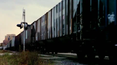 Train crossing intersection at dusk Stock Footage 12371305