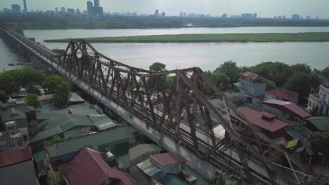 Train crossing the long bien bridge in hanoi, vietnam Stock Footage 329501558