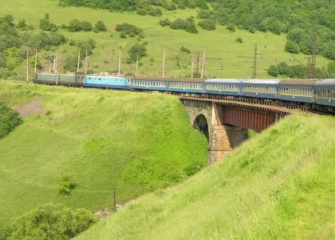 Train crossing an old bridge Stock Photos