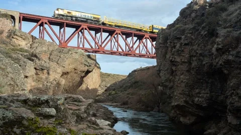 Train crossing passing old bridge over the river scenic nature Stock Footage 66744878