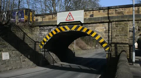Train crossing rail bridge over road at Woodlesford united kingdom Stock Footage
