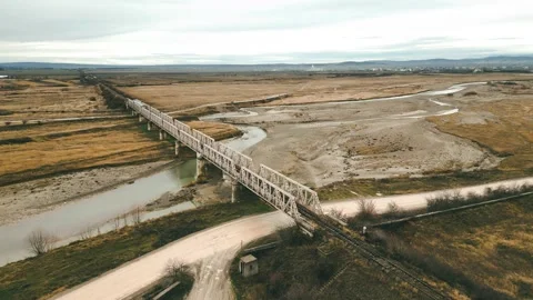 Train crossing railway bridge Stock Footage 228915489