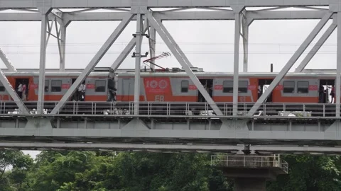 A train crossing a railway bridge Stock Footage 314509345