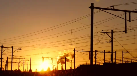 Train crossing railway at sundown. Stock Footage 65839548