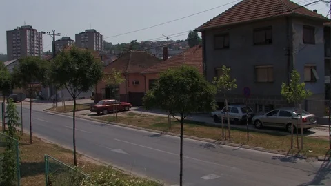 Train crossing small serbian town Stock Footage 93962934