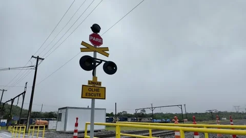 Train Crossing Stop Sign 'Pare' on Overcast Day, Brazil Stock Footage 335400474