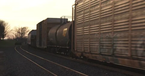 Train on Curve Going into the Sunset Stock Footage 82811183
