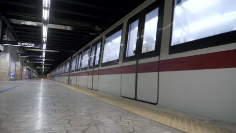 The train departs forom an empty metro stop platform in Rome Stock Footage 155071066