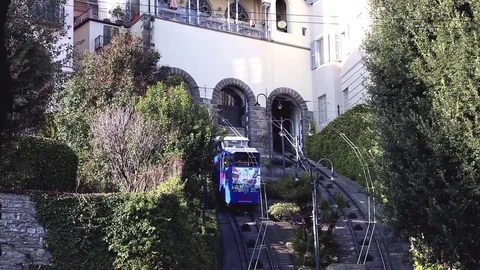 A Train descends or climbs through historic building in Italy Stock Footage 72954515