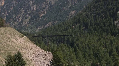 Train on distant bridge  Stock Footage 79630721