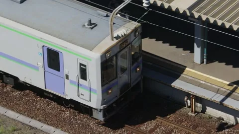 Train driver and passengers boarding KiHa 40 train, Hakodate, Japan, 2026.09.10. 動画素材 345424902