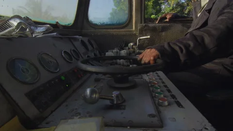 Train driver driving the old train in the cab DaresSalaam Tanzania Stock Footage 132411105