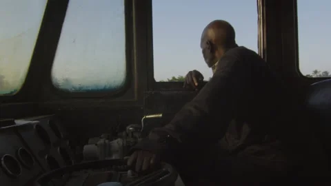 Train driver driving the train in the cab DaresSalaam Tanzania Stock Footage 132456431