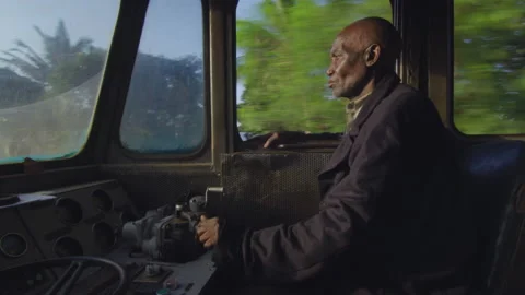Train driver driving the train in the cab DaresSalaam Tanzania Stock Footage 132551279