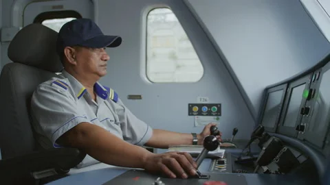 Train driver driving a train, Malaysia Video stock 134709167