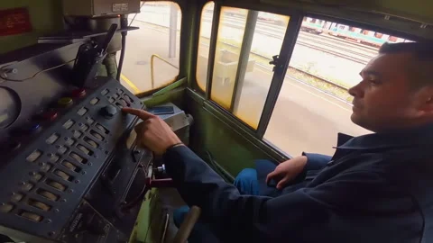 Train driver during ride of diesel electric locomotive EMD G16 in Banja Luka. Video stock 237632515