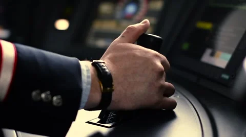 Train driver hand on thrust lever of dashboard controls in cockpit cabine Video stock 58507183