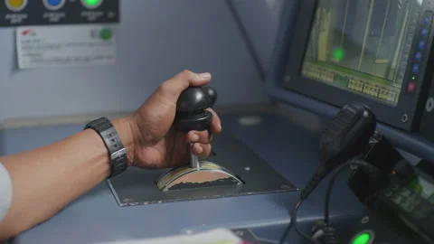 Train Driver Hand On Thrust Lever Of Dashboard Controls In Cockpit Cabine Stockbeeldmateriaal 134675424