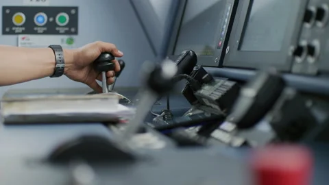 Train Driver Hand On Thrust Lever Of Dashboard Controls In Cockpit Cabine Stock Footage 134676562