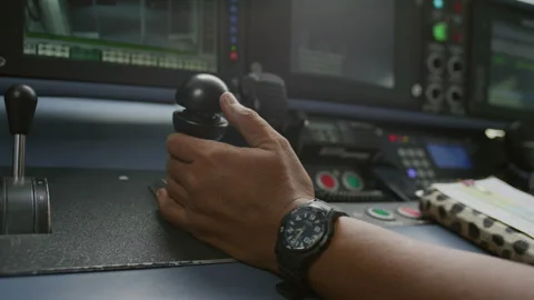 Train Driver Hand On Thrust Lever Of Dashboard Controls In Cockpit Cabine, Vídeo Stock 134714475