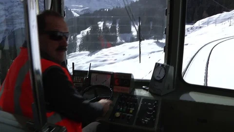 TRAIN DRIVER IN THE SNOW Stock Footage 121858636