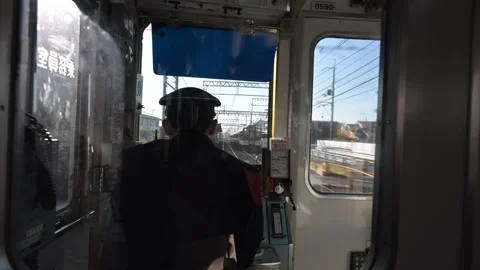 Train driver working in Japan, looking outside window Stock Footage 305411052