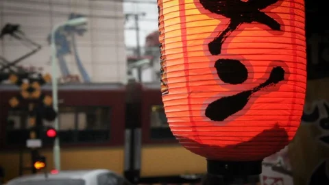 Train Drives by in Front of Red Lantern - Kyoto, Japan Video stock 87899616