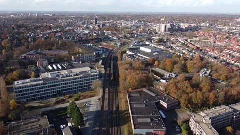 Train drives through Hilversum city in the Netherlands Stock Footage