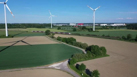 Train drives through a wind farm in Hamm, Germany 스톡 동영상 134494687