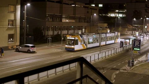 Train drives throw empty night streets Vídeos de archivo 103855489