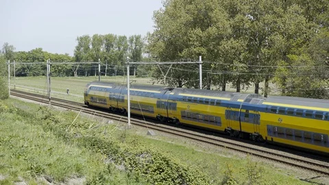 Train driving by in green area Stock Footage 89832160