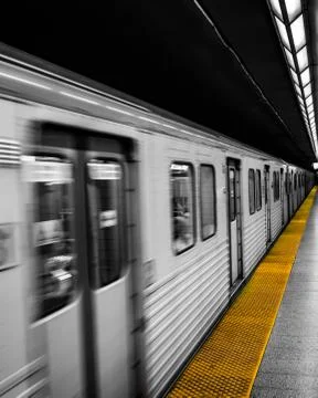 Train driving passed subway platform Stock Photos