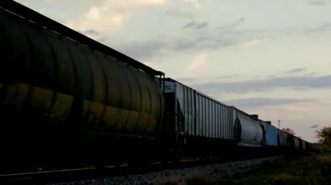 Train at dusk passing by Stock Footage 12372270