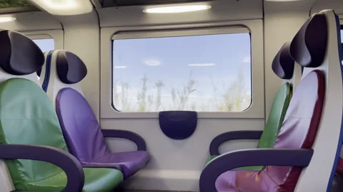 Train with empty passengers seats moving along the railway, view from inside of 스톡 동영상 269724272