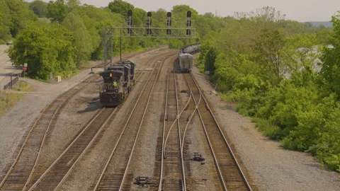Train engine backing up on the deserted train intersection Stockbeeldmateriaal 247242964