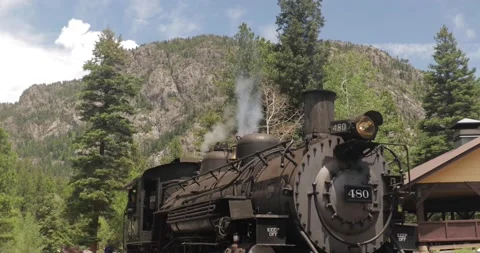 Train engine blowing steam in Durango Silverton Stock Footage 236435568