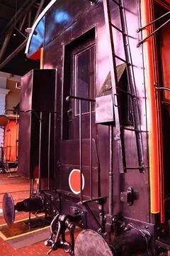 A train engine sitting on top of a train track, ready to depart or arriving at a Stock Photos