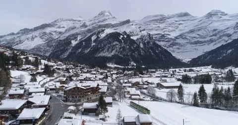 Train enter in Les Diablerets - Aerial 4K Stock Footage 104622344