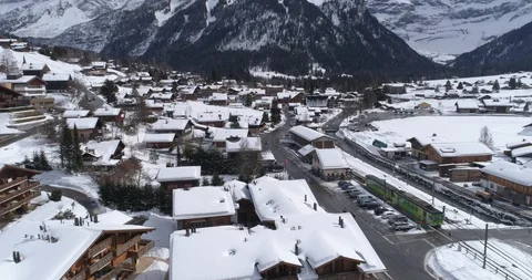 Train enter station Les Diablerets - Aerial 4K Stock Footage 104621690