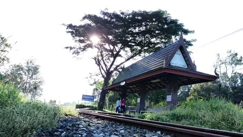 Train entering  local station Stock Footage 165588643